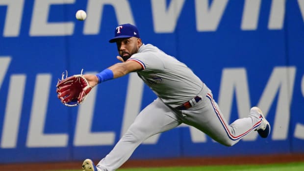 Sep 15, 2023; Cleveland, Ohio, USA; Texas Rangers left fielder Ezequiel Duran (21) can not make the catch of an RBI double hit by Cleveland Guardians first baseman Josh Naylor (not pictured) during the sixth inning at Progressive Field. Mandatory Credit: Ken Blaze-USA TODAY Sports  